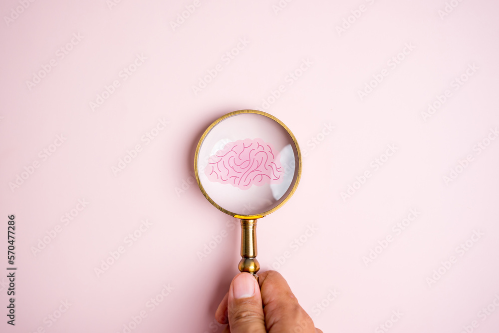 Magnifier focus to human brain icon, idea creative intelligence thinking or Awareness of Alzheimer, Parkinson's disease, dementia, stroke, seizure or mental health. Neurology and Psychology care. - obrazy, fototapety, plakaty 