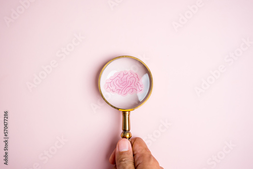 Magnifier focus to human brain icon, idea creative intelligence thinking or Awareness of Alzheimer, Parkinson's disease, dementia, stroke, seizure or mental health. Neurology and Psychology care.