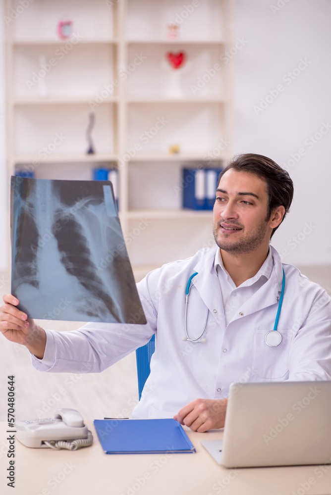 Young male doctor radiologist working in the clinic Young male doctor radiologist working in the clinic