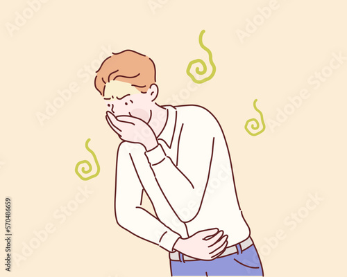 Portrait of young man drunk or sick vomiting. Hand drawn style vector design illustrations. photo