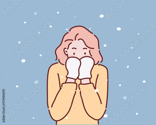 Winter woman in snow looking at camera outside on snowing cold winter day. Hand drawn style vector design illustrations.