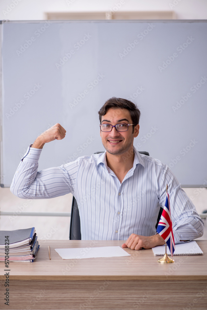 Fototapeta premium Young male english language teacher in the classroom