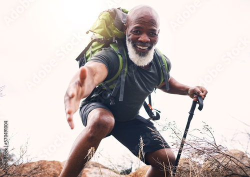 Fotografie Hiking, help and portrait of senior man reaching hand during hike, fitness and cardio in nature on light background
