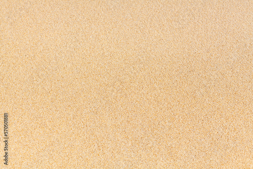 Yellow sand texture close up background, sandy pattern, natural fine sand grains backdrop, clean flat beige sand top view, light brown desert dune surface, summer tropical sea beach banner, copy space