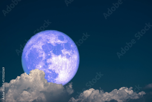 Full Snow Moon back dark gray cloud on the night sky