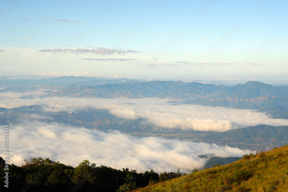 Landscape nature morning view with fog around mountain valley in  Kew Mae Pan nature trail in Chiang mai Thailand of Doi Inthanon National Park. 3 km hiking trail. Experience rainforest, grasslands
