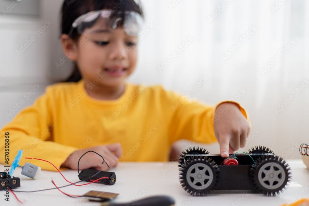 asia-students-learn-at-home-in-coding-robot-cars-and-electronic-board