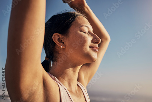 Yoga, woman and blue sky meditation in nature outdoor for fitness, training and workout. Happy model person with exercise for zen, peace and holistic time for health and wellness with beach pilates