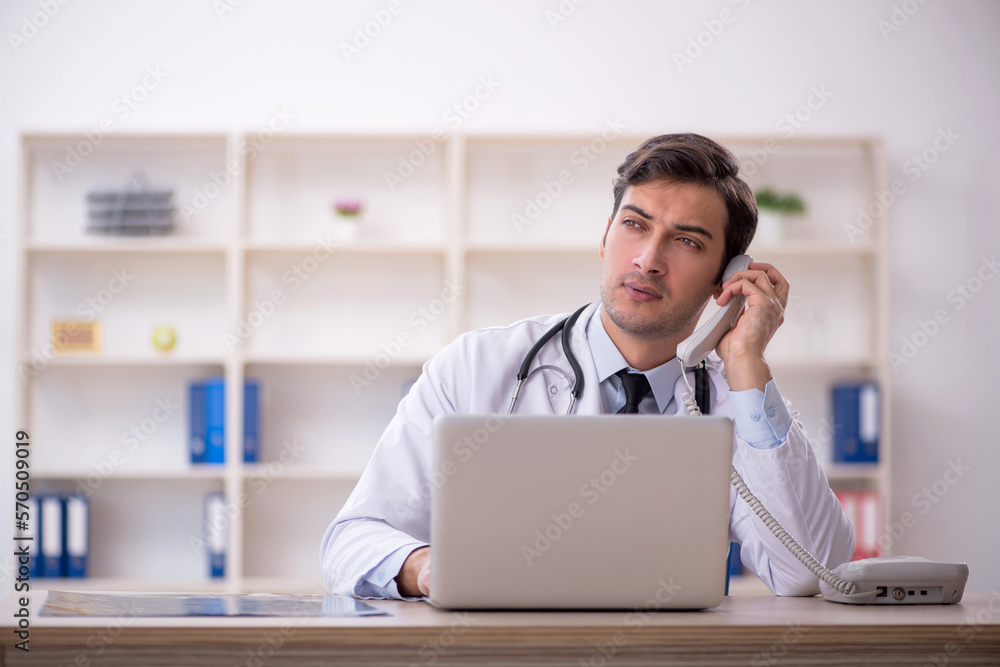 Young male doctor in telemedicine concept Young male doctor in telemedicine concept