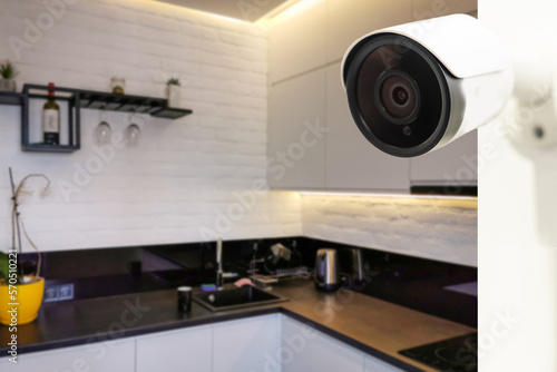 Close Up Object Shot of a Modern Wi-Fi Surveillance Camera on a White Wall in a Cozy Apartment