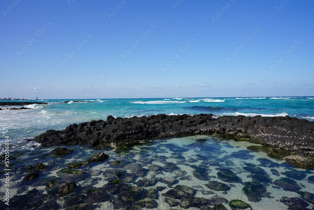 rock beach and clear water