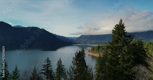 Fly out over Lake Cushman from the overlook. Beautiful forestand lake views with mountains photo