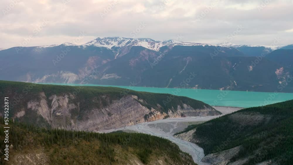 Aerial view of Muncho Lake Provincial Park, British Columbia, Canada. Cold glacier lake, Canadian Rockies mountains. Summer, cloudy, overcast morning Aerial view of Muncho Lake Provincial Park, British Columbia, Canada. Cold glacier lake, Canadian Rockies mountains. Summer, cloudy, overcast morning