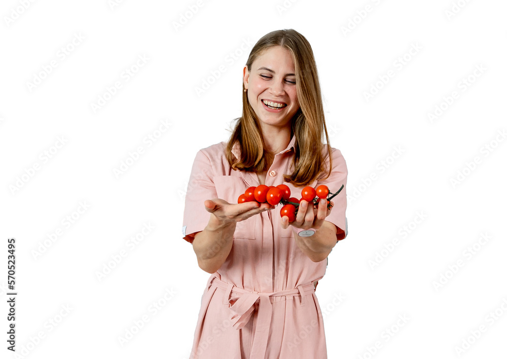 Woman at kitchen holding red tomato bunch in her hands. Housewife taking fresh ingredients for vegetable salad. Woman at kitchen holding red tomato bunch in her hands. Housewife taking fresh ingredients for vegetable salad.