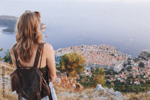 Back view of blond woman at Dubrovnik viewpoint photo