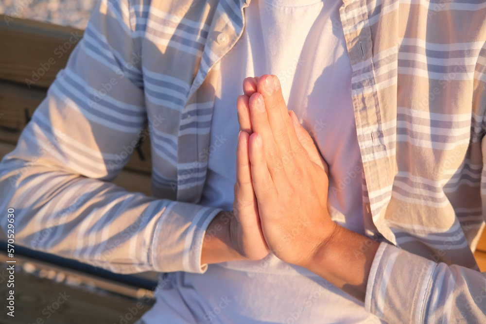 Hands in praying, close up of folded palms in pray gesture