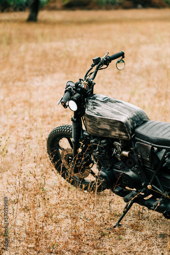 Detail of a motorbike in the countryside of Italy