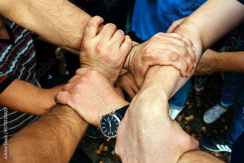 Men`s hands are woven together photo