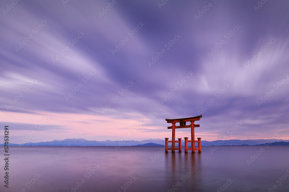 Long exposure shot of Shirahige shrine Torii gate at sunset at Lake Biwa, Shiga Prefecture, Japan Long exposure shot of Shirahige shrine Torii gate at sunset at Lake Biwa, Shiga Prefecture, Japan