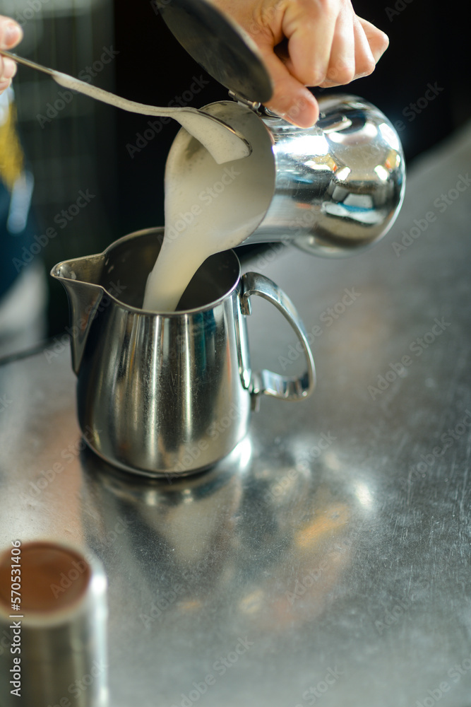 Hands of young adult caucasian female barista at work preparing Hands of young adult caucasian female barista at work preparing