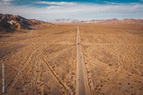 A lonely road through the Californian desert from above photo