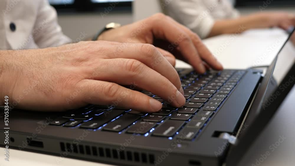 Office worker computer keyboard typing fingers closeup Office worker computer keyboard typing fingers closeup