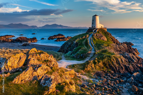 The beautiful Twr Mawr lighthouse at sunset on the island of Ynys Llanddwyn in  Anglesey, North Wales. photo