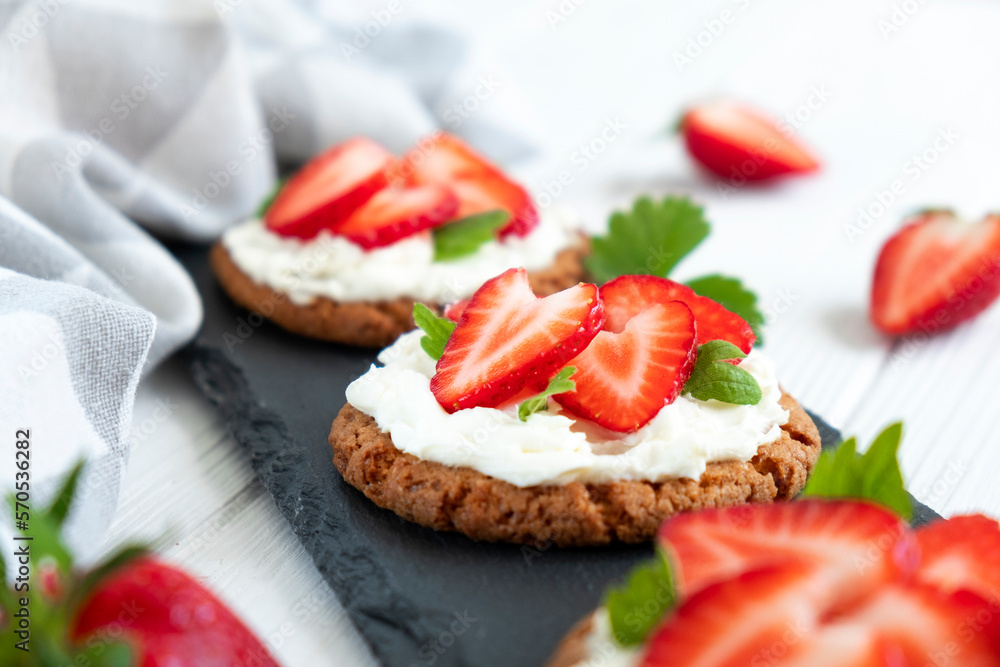 Healthy sandwich with strawberry and cream cheese on slate board. Tasty breakfast. Clean eating, diet or easy recipe of vegetarian sandwich for vegan menu. Healthy sandwich with strawberry and cream cheese on slate board. Tasty breakfast. Clean eating, diet or easy recipe of vegetarian sandwich for vegan menu.