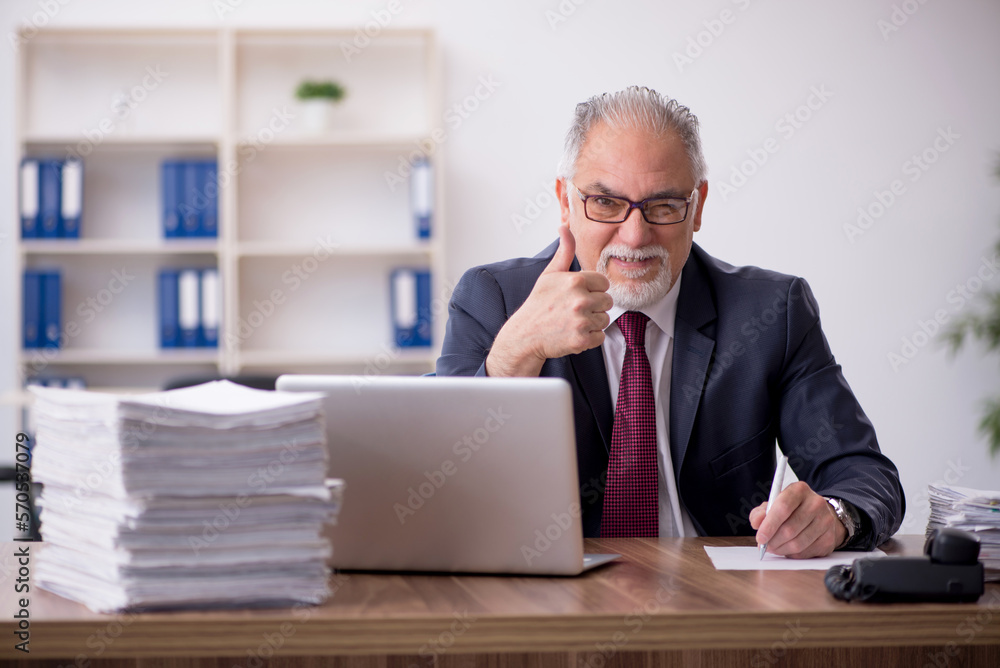 Old male employee and too much work in the office Old male employee and too much work in the office