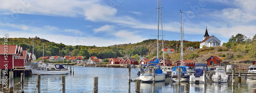 boats moored in the port and red cabins of a small swedish seaside town Molle