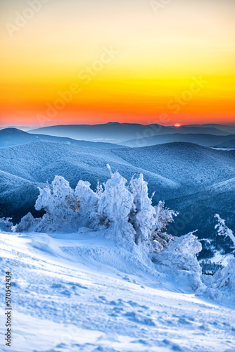 Fototapeta Naklejka Na Ścianę i Meble -  Four countries in one photo. Poland, Slovakia, Ukraine and Hungary. Beautiful winter sunset from the mount Tarnica, Bieszczady National Park, Poland.