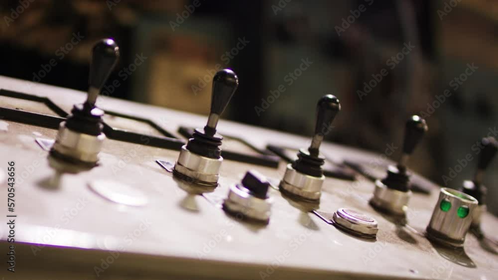 Dolly shot of lever buttons on control panel in metal industry Dolly shot of lever buttons on control panel in metal industry