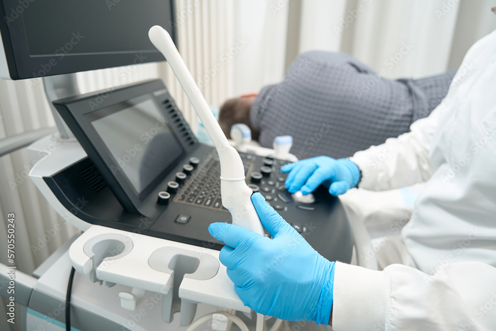Specialist turn on medicine machine for diagnosis illness in hospital Specialist turn on medicine machine for diagnosis illness in hospital