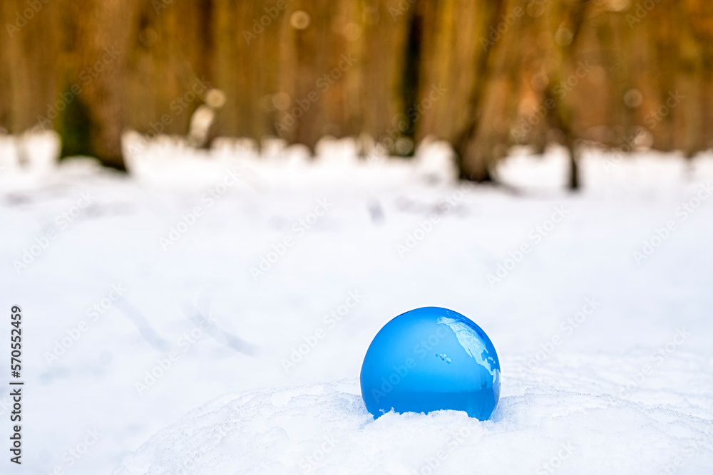 crystal earth globe on snow