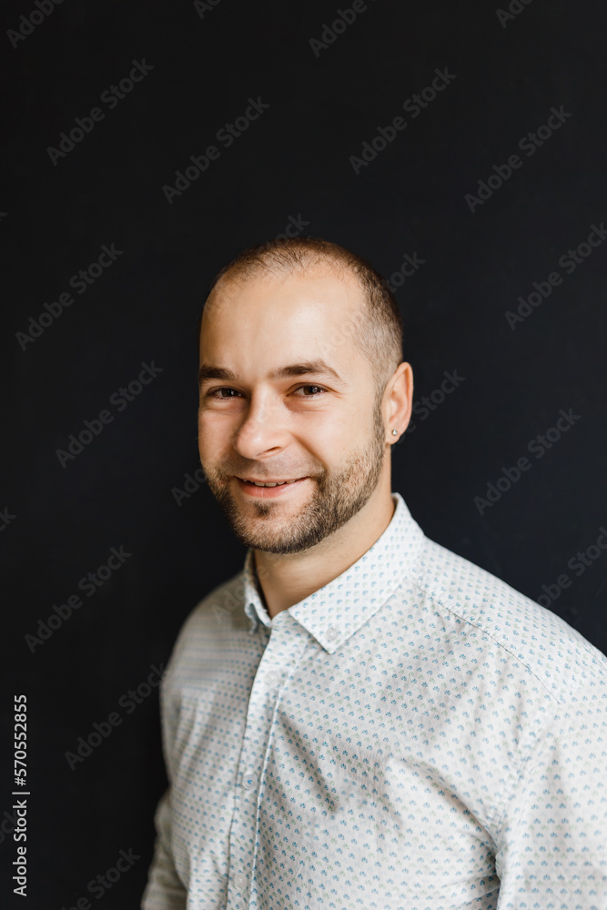 portrait of a thirty-year-old businessman in jeans and a shirt