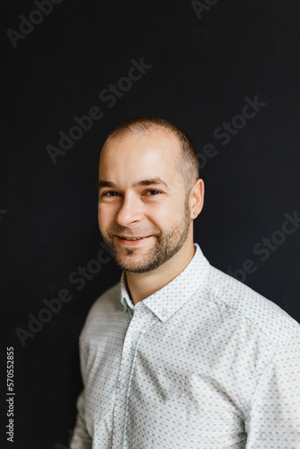portrait of a thirty-year-old businessman in jeans and a shirt