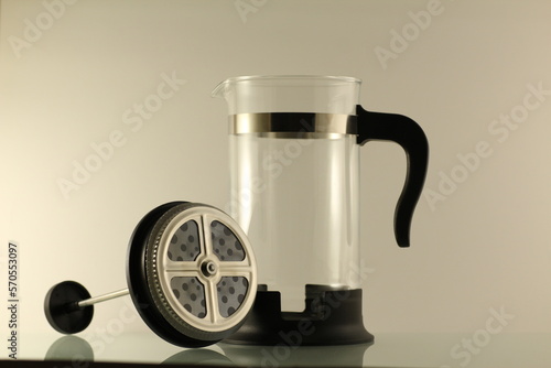 Stainless steel and glass jug for coffee making, isolated.
