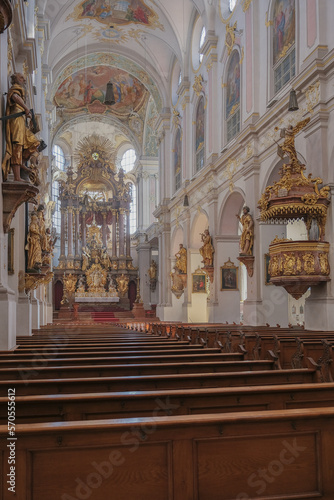 Magnificent opulent splendid Bavarian baroque church cathedral basilica interiors with stucco, murals, altar, Pilars, ceiling paintings, gold, wood domes nave