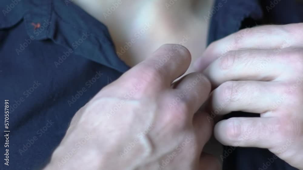 Slow Motion Young Man Unbuttoning A Blue Shirt Close-Up Slow Motion Young Man Unbuttoning A Blue Shirt Close-Up