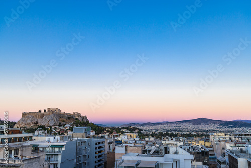 Cityscape of Athens during sunset with view of the acropolis and Parthenon temple in Greece
