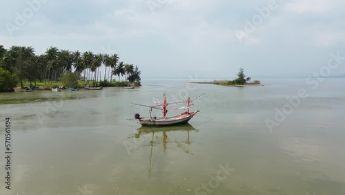Frying over fishing boats on the river