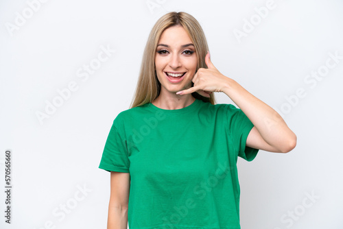 Pretty blonde woman isolated on white background making phone gesture. Call me back sign