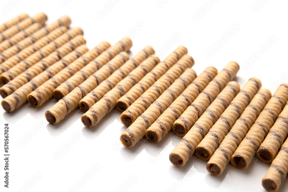 Crispy wafer rolls on a white background. Crispy wafer rolls on a white background.