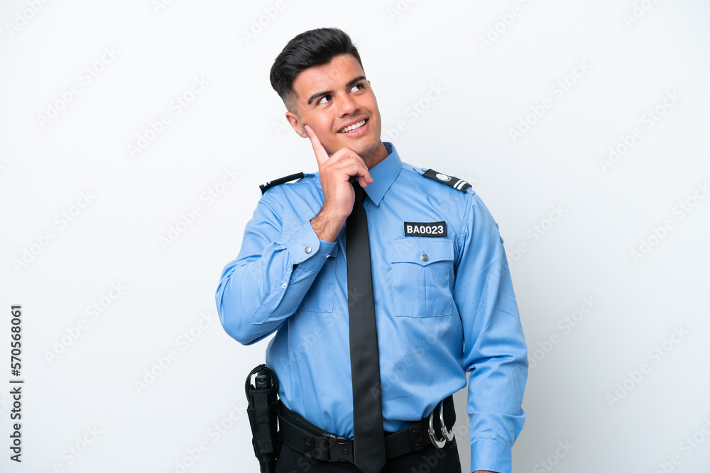 Young police caucasian man isolated on white background thinking an idea while looking up Young police caucasian man isolated on white background thinking an idea while looking up