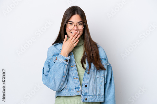 Young Brazilian woman isolated on white background happy and smiling covering mouth with hand