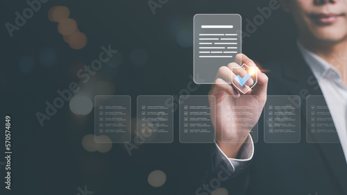 Businessman showing online document validation icon, Concepts of practices and policies, company articles of association Terms and Conditions, regulations and legal advice, corporate policy photo