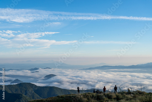 Sea of clouds and mountains seen from the top of the mountain, and people watching the sea of clouds