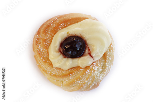 Italian traditional fried Zeppola for St. Joseph (Father’s day). Homemade sweet pastry with custard cream and black cherry on white photo