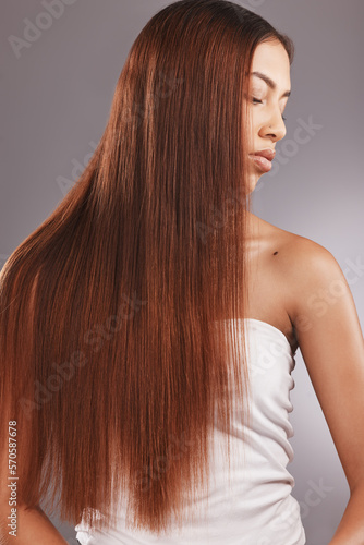 Black woman with straight brown hair isolated on studio background for healthy glow, beauty shine or care. Young USA model or person for natural growth, red dye color and salon hairdresser treatment