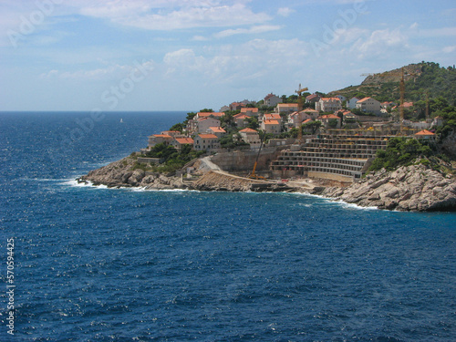 A view off Dubrovnik's coast on a sunny day with a blue sky.  Image has copy space.